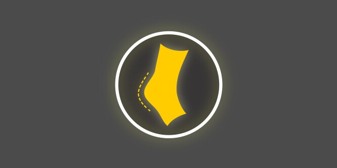 Geel-wit pictogram met een hiel van een voet binnen een cirkel, op een donkergrijze achtergrond, dat minder schuren en wrijving weergeeft.
